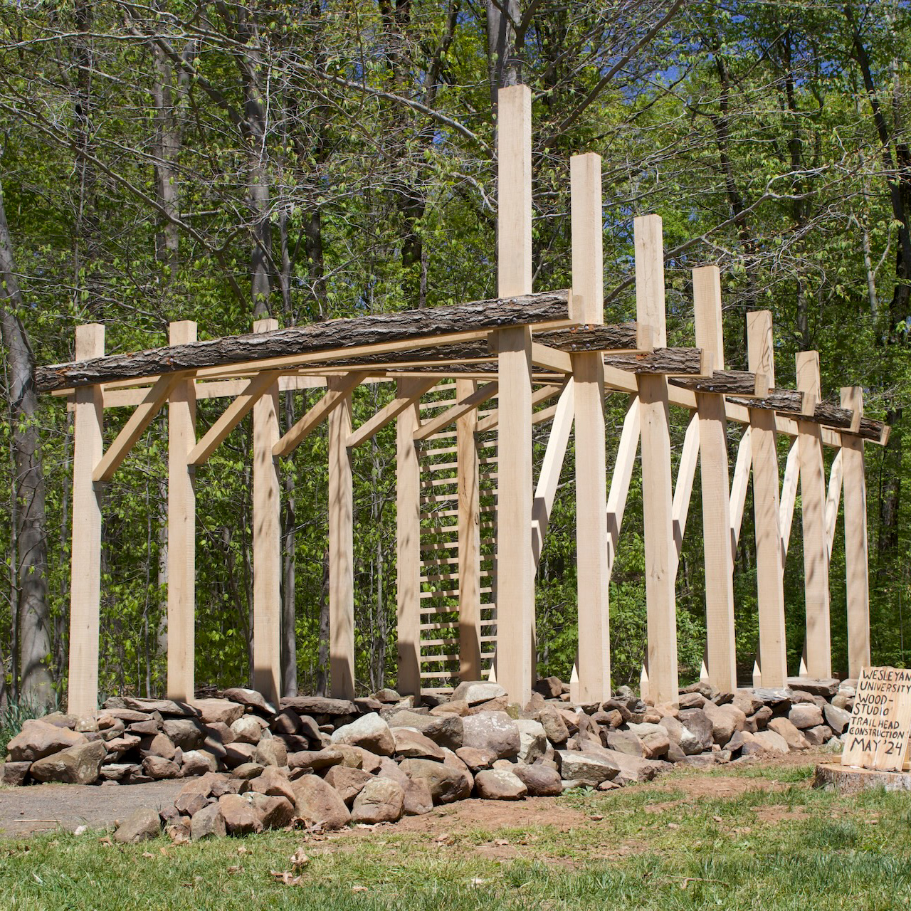 Forest Threshold — timber gateway and dry-stone foundation in the forest